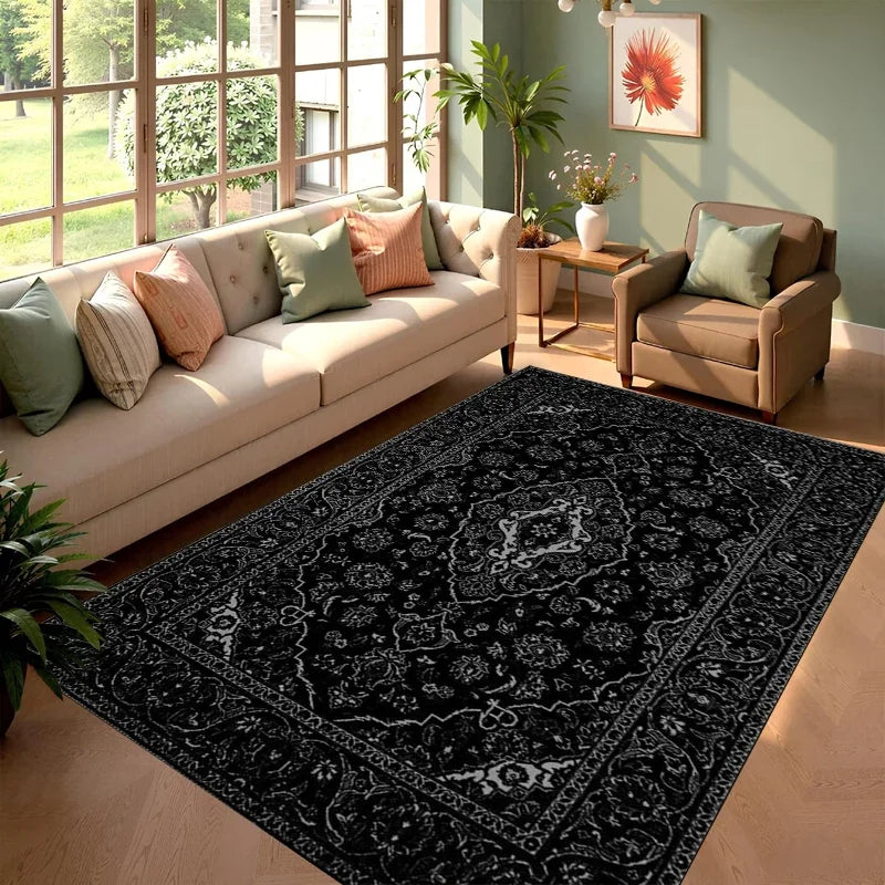 A black and white ornate area rug featuring a traditional pattern placed in a modern living room setting.