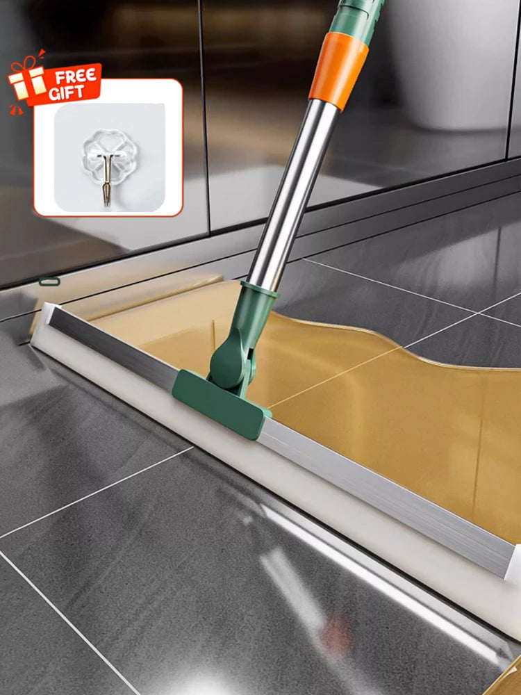 A silicone scraper broom and squeegee tool is shown cleaning a kitchen sink.