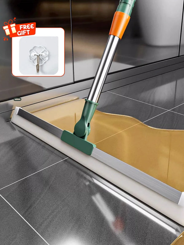 A silicone scraper broom and squeegee tool is shown cleaning a kitchen sink.