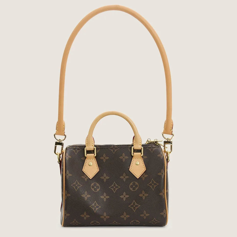 A brown synthetic leather bag strap for handbags and purses with a flap closure.