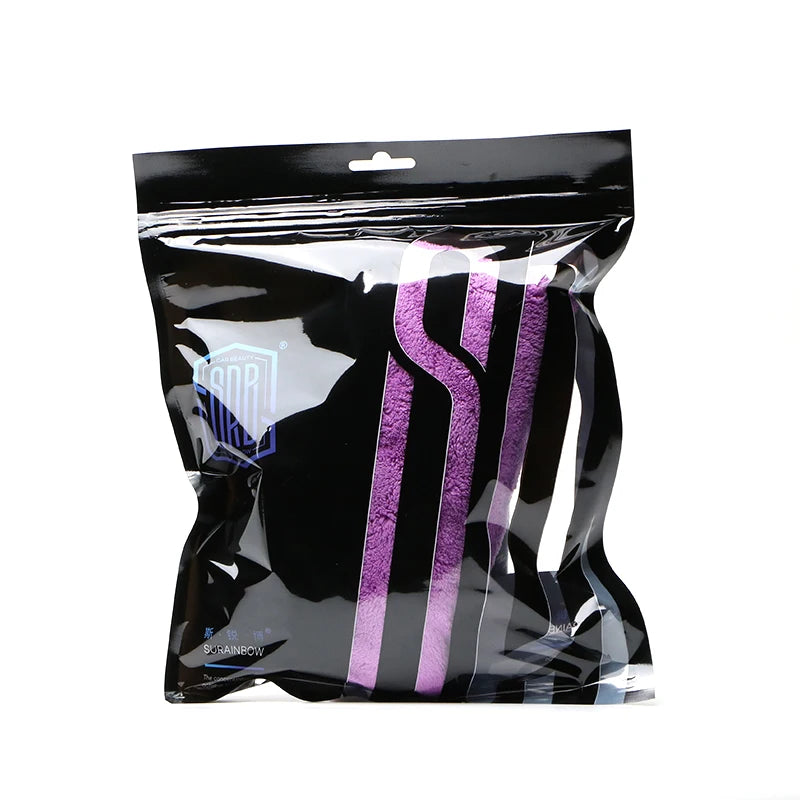 A clear plastic bag containing purple microfiber cleaning cloths.