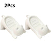 Two white cat-shaped soap dishes with drainage trays
