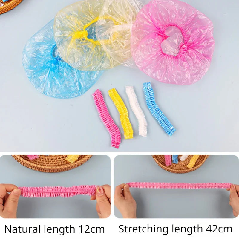 Colorful disposable transparent waterproof shower caps and their stretching lengths shown next to a woven basket.