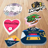 A collection of custom die-cut vinyl stickers featuring names, holidays, and school themes on a wooden surface.