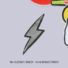 A black lightning bolt iron-on embroidered patch with white detailing shown against a light gray background.