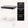 Clear plastic automatic pop-up laundry pod holder with a black airtight lid and three labeled detergent containers.