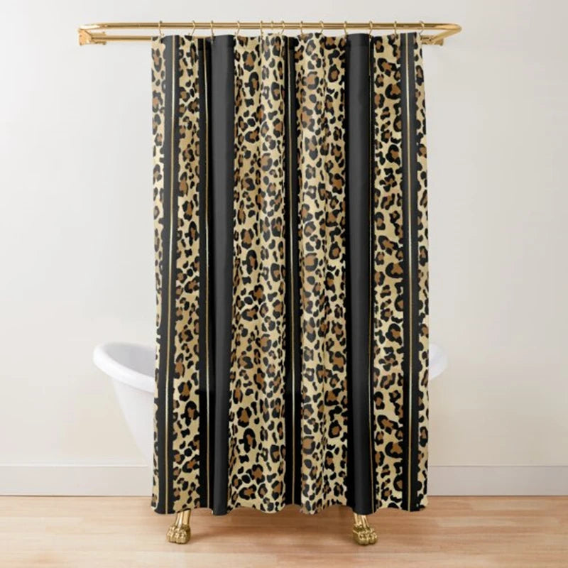 A black and gold leopard print shower curtain hanging from a wooden rod.