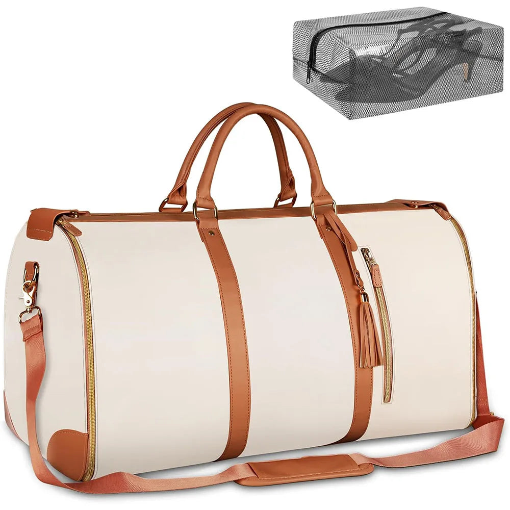 A beige foldable travel duffel bag with brown leather accents and a mesh shoe pouch visible.