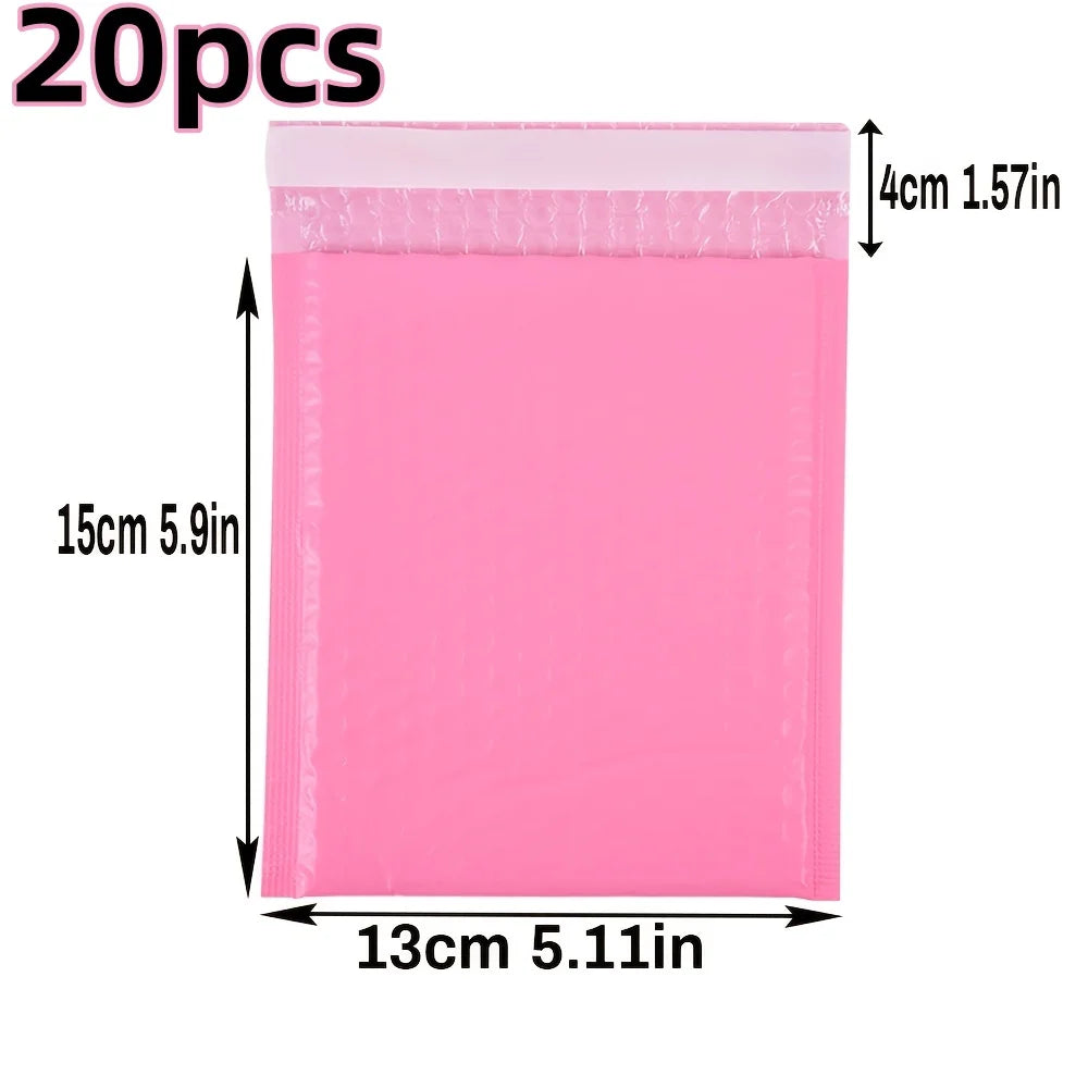 A pink self-seal padded bubble mailer with dimensions 15cm x 13cm.