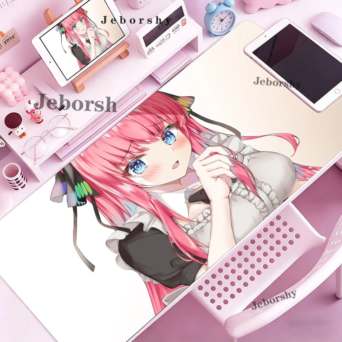 A pink-haired anime girl illustration on a mouse pad featuring her character and accessories.