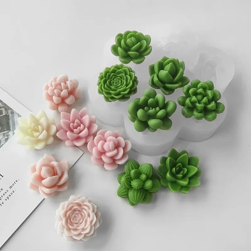 A set of silicone molds shaped like various green and pink succulent flowers for DIY crafts.