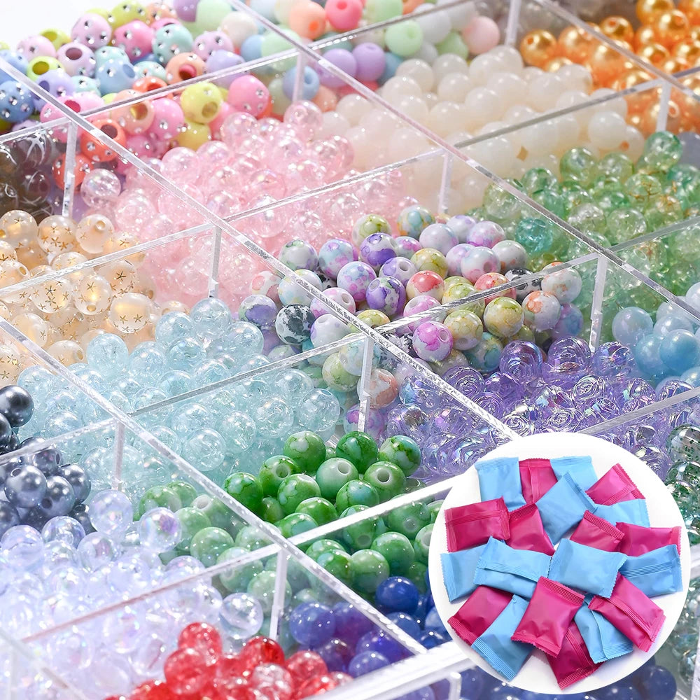 A close-up view of a clear box filled with various mixed colored acrylic beads for jewelry making