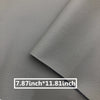 A close-up of a gray leather repair patch showing the stitching and dimensions 7.87 inch by 11.81 inch.