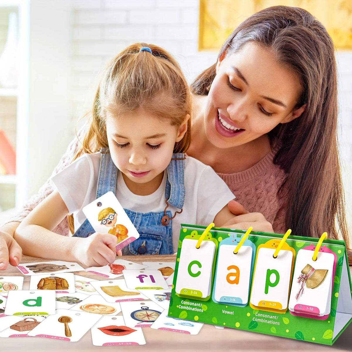 A young girl and woman play with a colorful word builder flash card game for educational purposes.