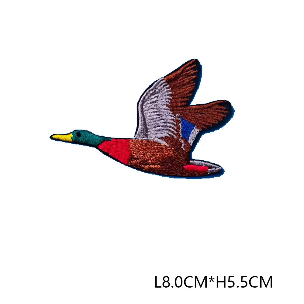 3D embroidered hunting patch featuring a bird in brown, white, and blue colors.
