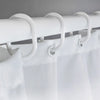 White shower curtain with leopard print fabric hanging from a white rod and hooks