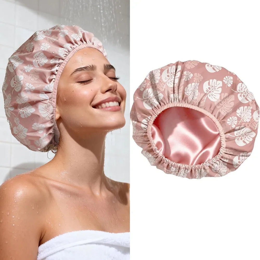 A pink satin lined waterproof shower cap for hair protection shown on a model and as a separate product view.