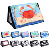 A high-contrast crinkle cloth book with a tummy time mirror for babies featuring sea creatures.