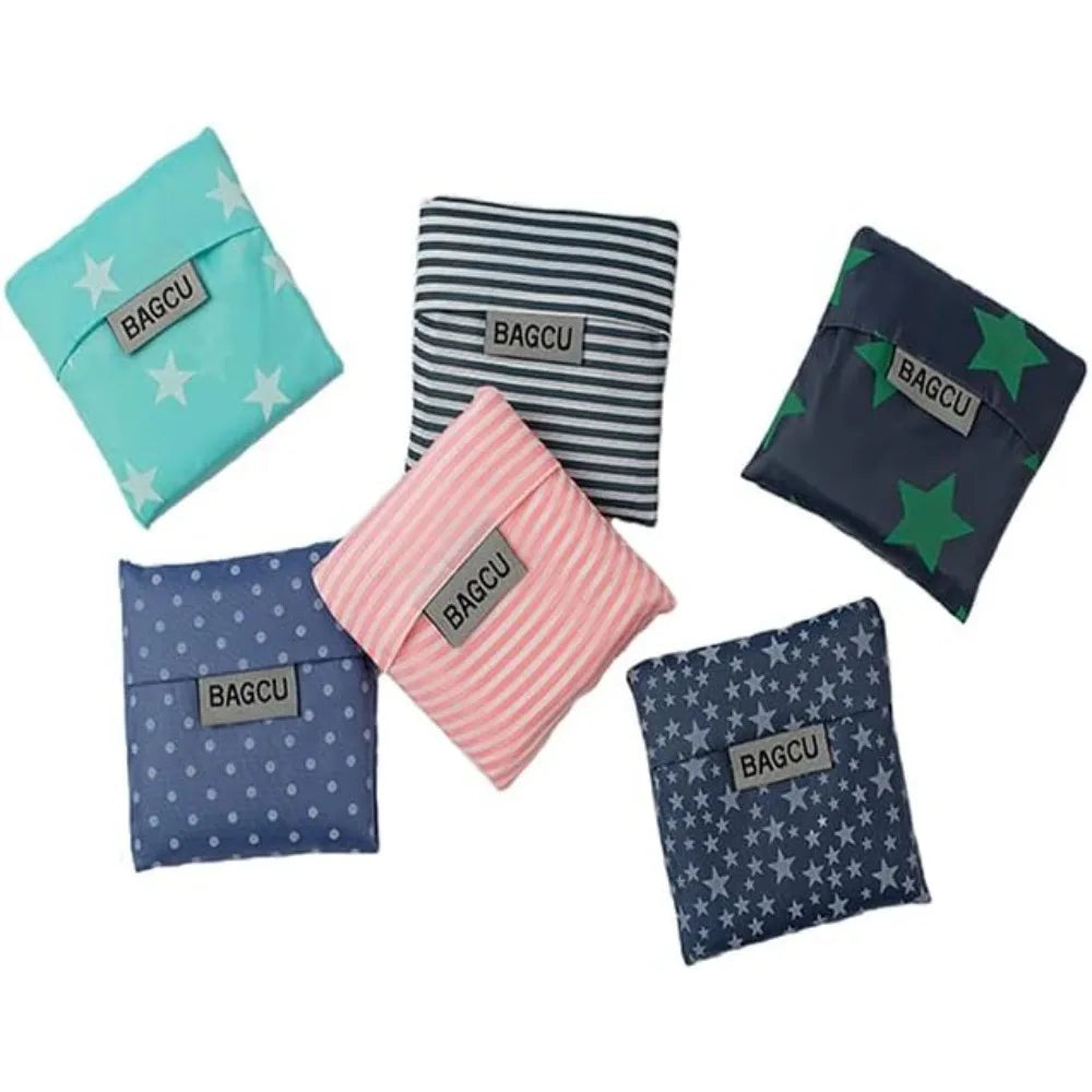 A collection of five patterned fabric bags in various colors including teal, black, pink, and blue.