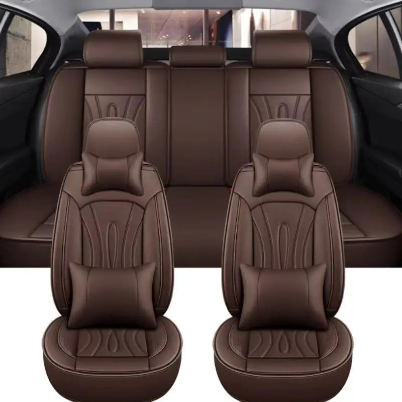 A set of full coverage brown PU leather car seat covers shown in the interior of a vehicle.