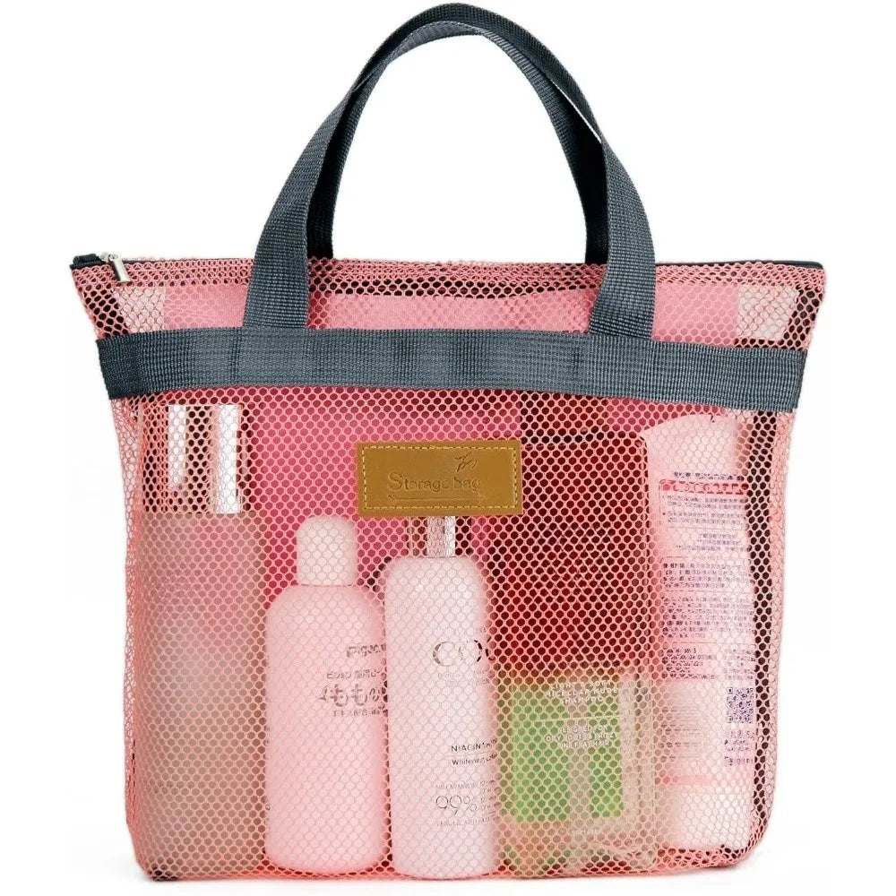 A pink mesh hanging toiletry bag with a black handle, containing various personal care items.