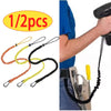 Set of five colored bungee tethers with carabiner hooks shown next to a hand using a camera mount.