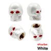 A set of four white skull design tire valve stem caps with red accents.