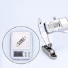 A silver stainless steel sliding door roller pulley with a digital measuring scale showing 12.8 mm.