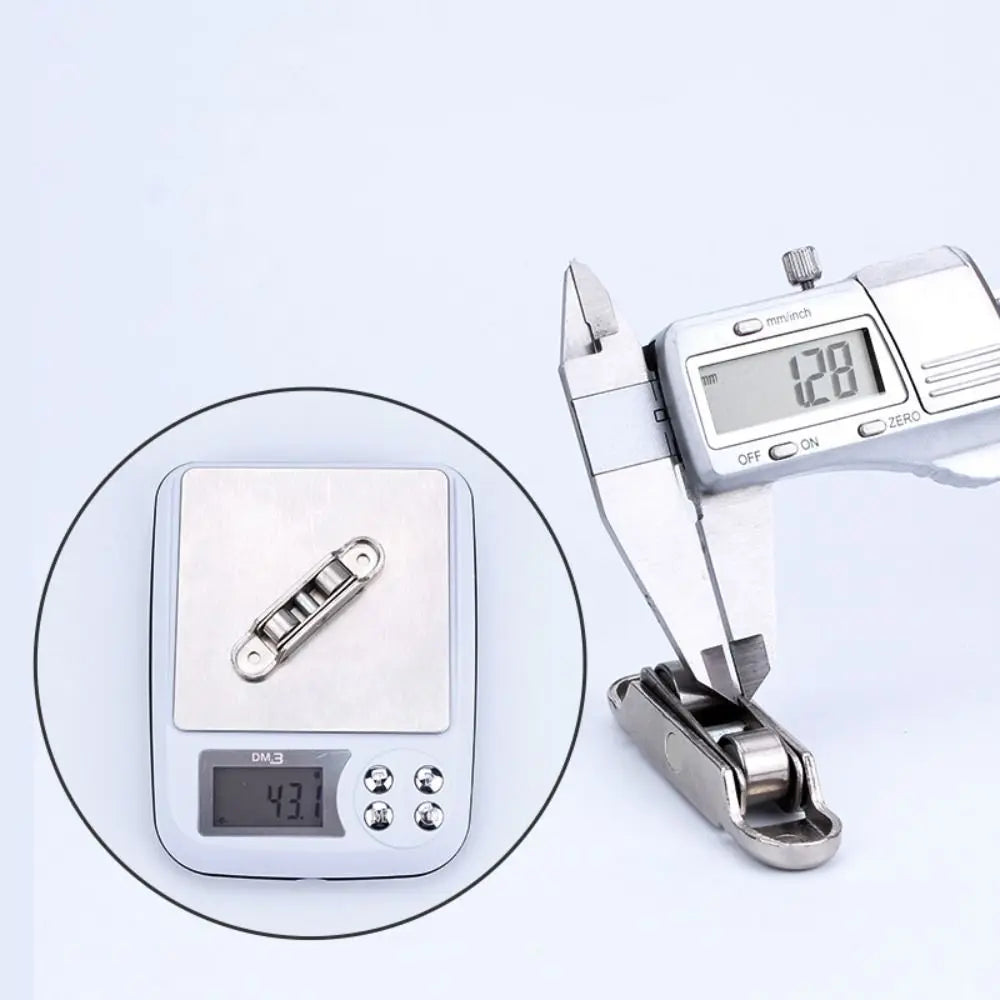 A silver stainless steel sliding door roller pulley with a digital measuring scale showing 12.8 mm.