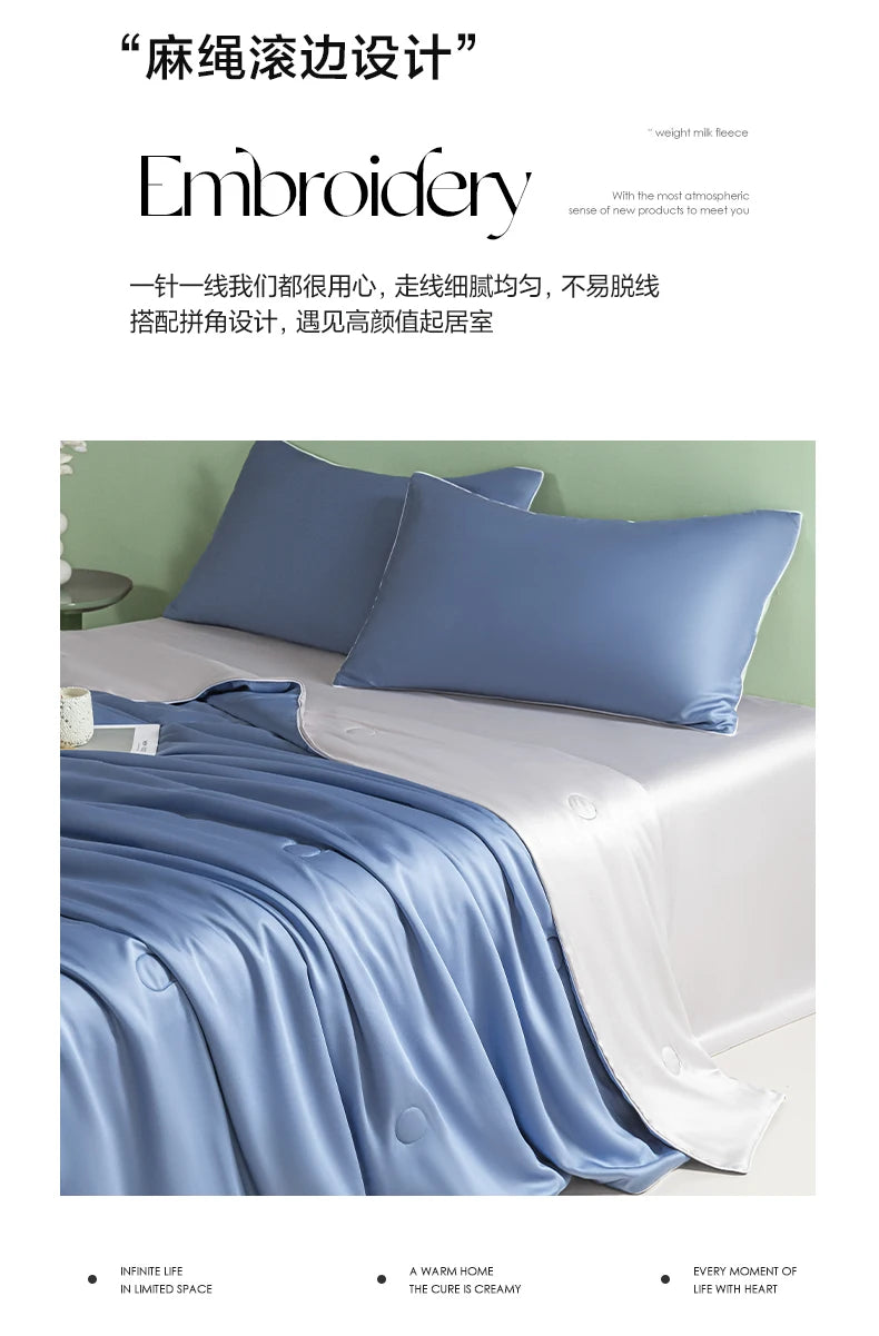 A light blue ice silk quilt draped on a bed, showcasing the fabric's smooth texture and drape.