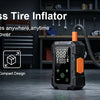 A portable cordless tire inflator with a digital display and orange accents is shown next to a car tire.