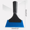 Black car window squeegee with a soft rubber blade resting on a blue surface.