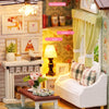 A DIY miniature dollhouse kit featuring a wooden 3D puzzle craft with LED lights displayed in a rustic setting.