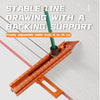 A green drawing line with a backing support is shown alongside an orange magnetic positioning marking ruler.