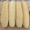 Four cylindrical natural loofah body scrubbers with hanging ropes displayed side by side.