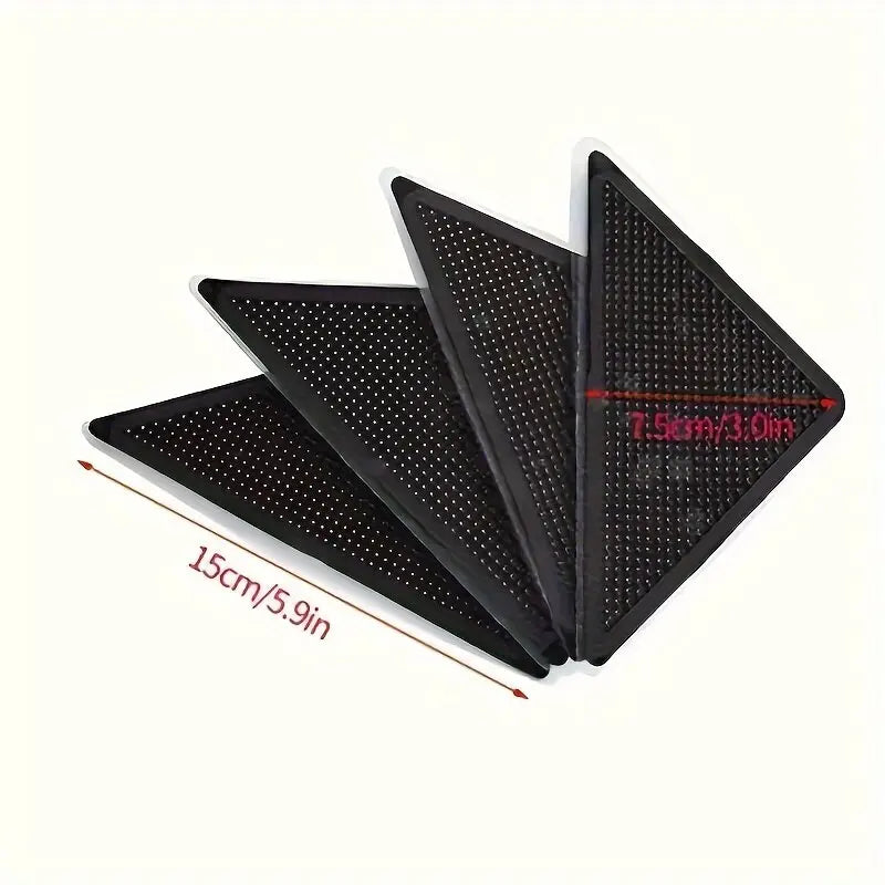 A pack of four non-slip rug pad grippers designed for securing rugs on hardwood and tile floors.