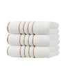 A stack of three white towels with gold stripes, likely a 3-piece set.