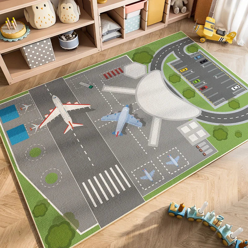 A colorful play mat depicting a road with cars and traffic signs for kids in a nursery or playroom.