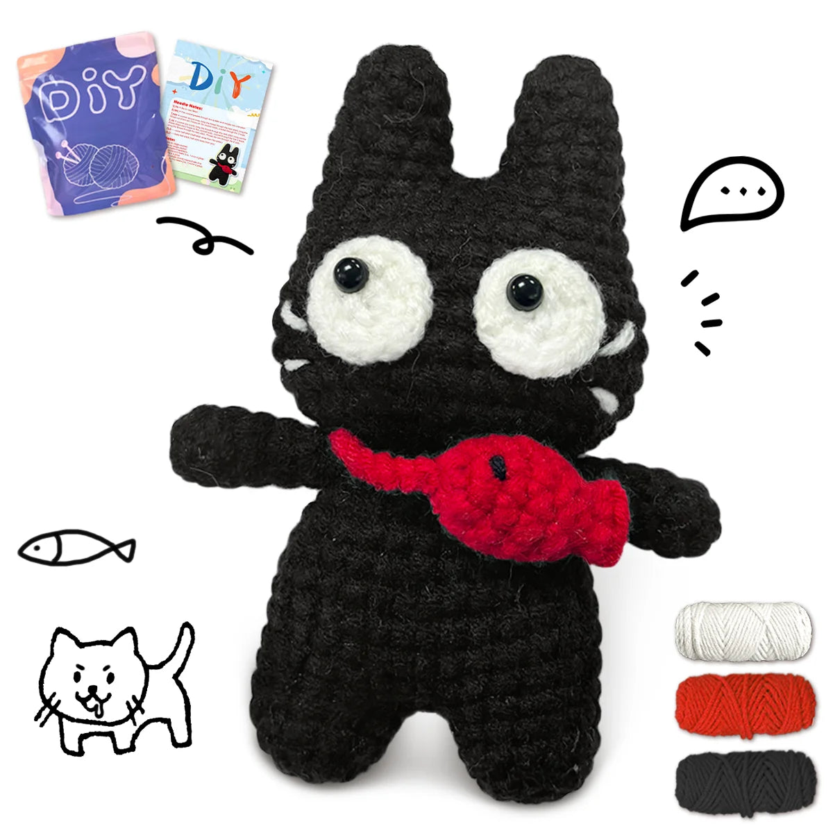 A black crocheted animal amigurumi featuring large eyes and a red accessory, with yarn and instructions nearby.