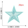A teal star embroidery patch is shown against a measurement scale, indicating its size and detail.