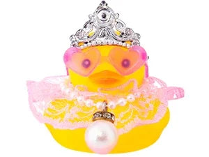 A yellow rubber duck decoration adorned with a silver crown, pink sunglasses, and a pearl necklace.
