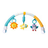 A colorful arch toy for a baby stroller featuring hanging plush charms like a smiling sun, a yellow bird, and a purple owl.