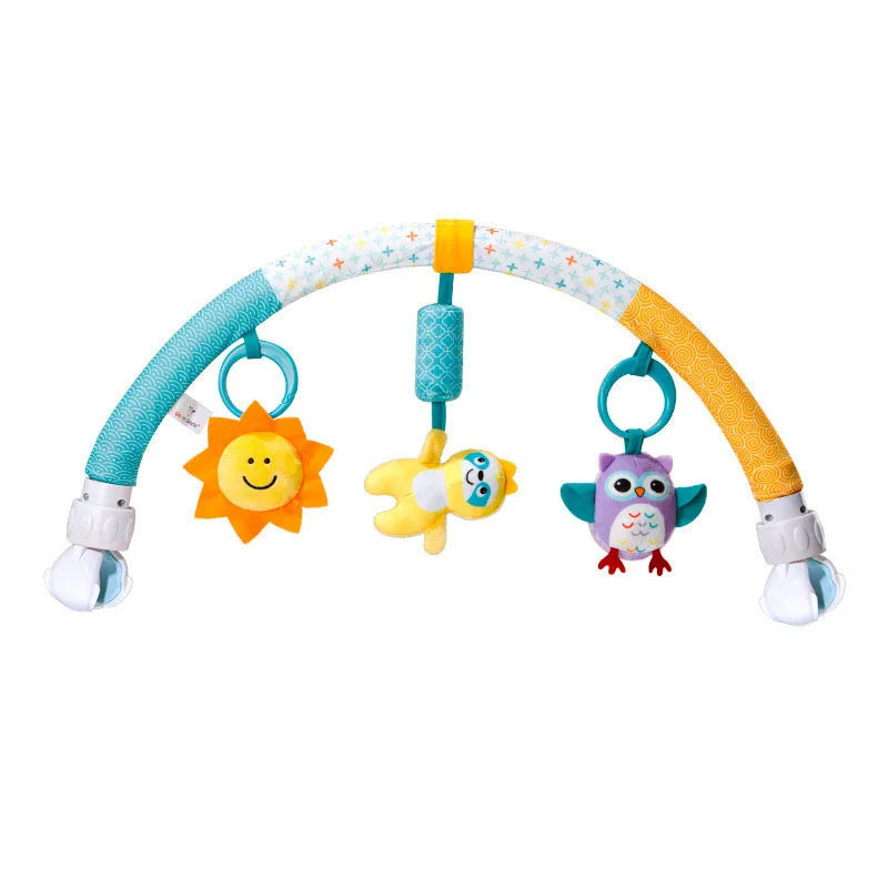 A colorful arch toy for a baby stroller featuring hanging plush charms like a smiling sun, a yellow bird, and a purple owl.