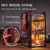 A DIY book nook featuring an elaborate bookstore scene with internal lighting and a touch switch.