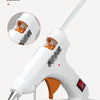 A white hot melt glue gun with an orange handle and a metal nozzle is shown against a white background.