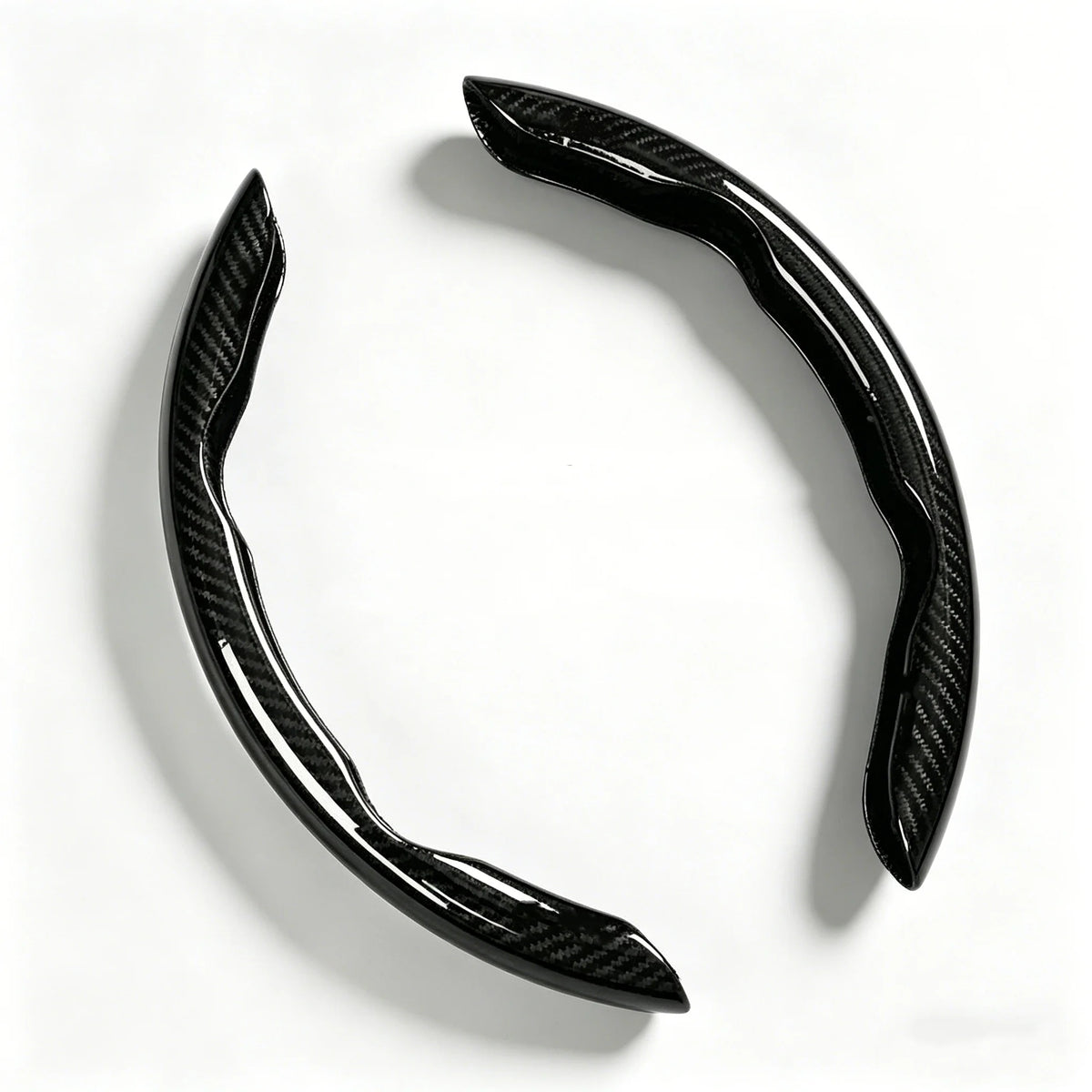 A black carbon fiber pattern steering wheel cover with an anti-slip grip.