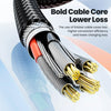 A close-up view of a thick black cable core with gold connectors, illustrating bold cable core lower loss technology.