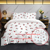 White duvet cover set featuring a red cherry print and matching pillowcases displayed on a bed.