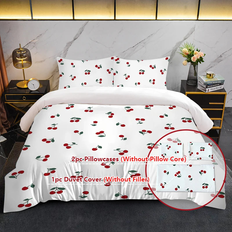 White duvet cover set featuring a red cherry print and matching pillowcases displayed on a bed.