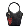A black handbag with a handle featuring a red rhinestone octopus and turtle pendant charm.